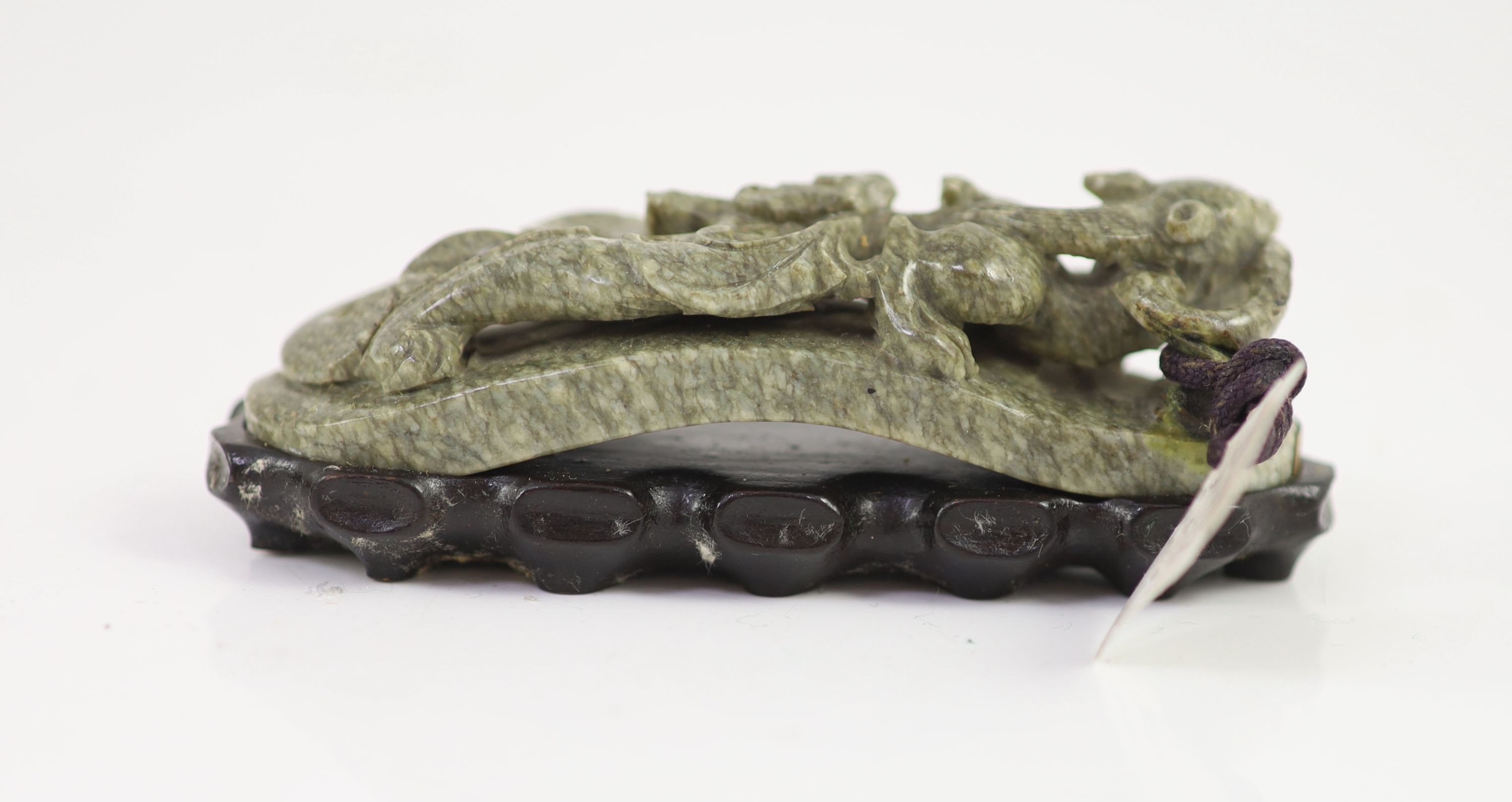 A Chinese ‘chicken bone’ jade carving, 17th/18th century 11 cm long including wood stand